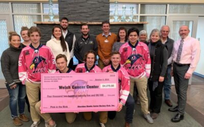 Hawks Donate “Pink the Rink” Funds to Welch Cancer Center